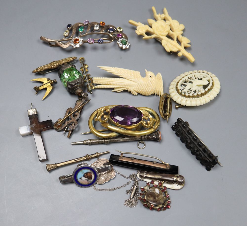 A small group of Victorian and later jewellery including a mourning brooch and silver and enamel dog brooch